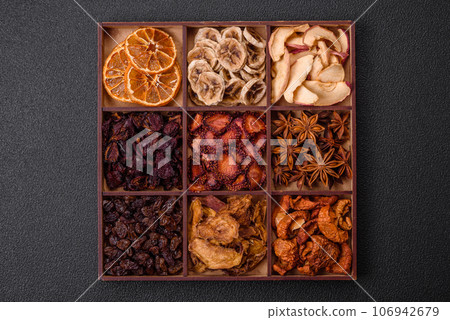 Variation of dry fruits strawberry, apple, cherry, banana, peach, plum and star anise Variation of dry fruits strawberry, apple, cherry, banana, peach, plum and star anise 106942679