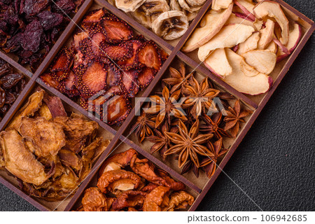 Variation of dry fruits strawberry, apple, cherry, banana, peach, plum and star anise 106942685