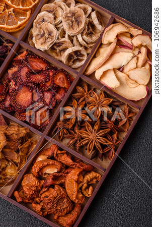 Variation of dry fruits strawberry, apple, cherry, banana, peach, plum and star anise 106942686