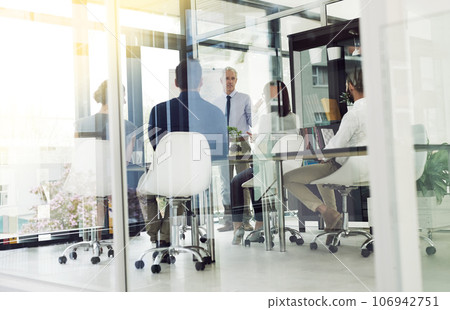 White collar business. Shot of corporate businesspeople in the office. White collar business. Shot of corporate businesspeople in the office. 106942751