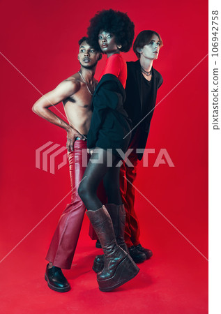 Fashion, group and portrait with diversity of gay people with creative black woman, man and model on red background. Lgbt, friends and beauty for edgy, gen z or unique aesthetic makeup in studio 106942758