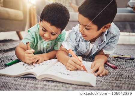 Kids, brothers and drawing while learning on floor at home, relax and happy while bonding. Children, art and sketch in notebook by siblings having fun in living room, smile and enjoying brotherhood Kids, brothers and drawing while learning on floor at home, relax and happy while bonding. Children, art and sketch in notebook by siblings having fun in living room, smile and enjoying brotherhood 106942829