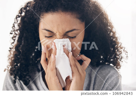 Black woman, tissue and sneeze of a sick young person blowing nose with toilet paper for safety. Flu, fever and cold of a female feeling tired from sirus infection at home with a health problem Black woman, tissue and sneeze of a sick young person blowing nose with toilet paper for safety. Flu, fever and cold of a female feeling tired from sirus infection at home with a health problem 106942843