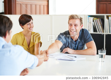 I think this will work for everyone. Shot of a young couple meeting with their financial advisor. I think this will work for everyone. Shot of a young couple meeting with their financial advisor. 106942845