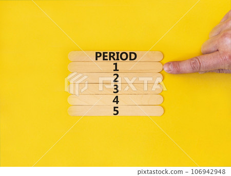 Time to period 1 symbol. Concept word Period 1 2 3 4 5 on wooden sticks. Businessman hand. Beautiful yellow table yellow background. Business planning and time to period 1 concept. Copy space. 106942948