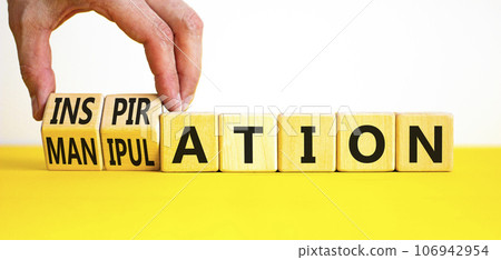 Inspiration or manipulation symbol. Concept words Inspiration and Manipulation on wooden cubes. Beautiful white background. Psychologist hand. Psychology inspiration manipulation concept. Copy space. 106942954