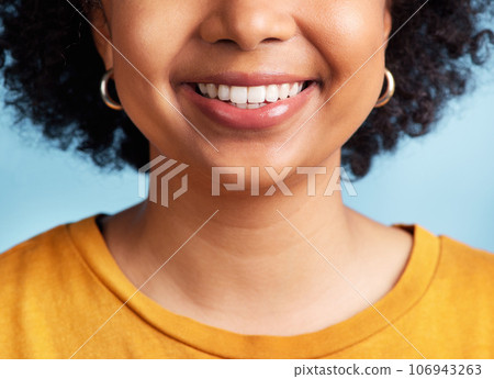 Smile, woman and closeup of mouth and teeth for dental care, hygiene and whitening results. Happy, model and girl showing tooth for treatment progress isolated on a blue background in a studio Smile, woman and closeup of mouth and teeth for dental care, hygiene and whitening results. Happy, model and girl showing tooth for treatment progress isolated on a blue background in a studio 106943263