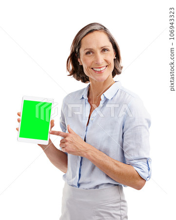Inviting you to take a look at this website. Studio portrait of a well-dressed mature woman holding a digital tablet with a chroma key screen. 106943323