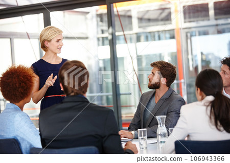 Planning together on the project. Cropped shot of a female business professional sharing her ideas with her colleagues. Planning together on the project. Cropped shot of a female business professional sharing her ideas with her colleagues. 106943366