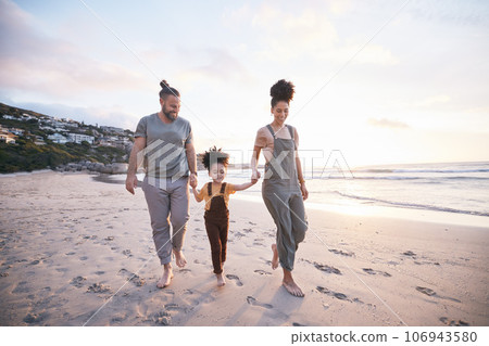 Family, holding hands and walking on beach at sunset, bonding and mockup space. Father, mother and happy kid at ocean in interracial care, love or smile on vacation, holiday or summer travel together Family, holding hands and walking on beach at sunset, bonding and mockup space. Father, mother and happy kid at ocean in interracial care, love or smile on vacation, holiday or summer travel together 106943580