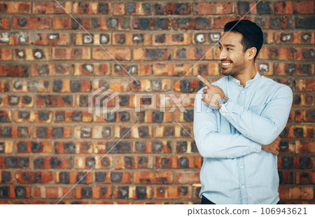 Pointing, mockup and smile with man and wall background for announcement, product placement and offer. Idea, news and deal with male and hand gesture with for information, empty space and opportunity 106943621
