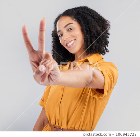 Happy, peace sign and portrait of woman in studio for positive, agreement and support. Thank you, yes and emoji with female isolated on gray background for achievement, confident and thank you 106943722