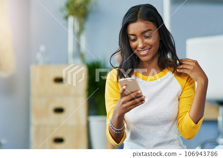 Home communication, phone and happy woman typing, texting and search online, internet or app website. Smile, happiness and Indian person on cellphone, mobile application and message social media user Home communication, phone and happy woman typing, texting and search online, internet or app website. Smile, happiness and Indian person on cellphone, mobile application and message social media user 106943786