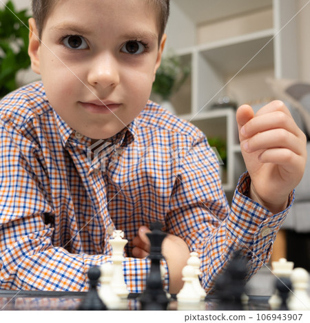 Little boy playing chess. Board games for children 106943907