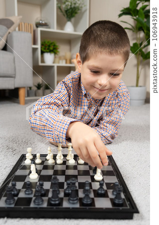 Little boy playing chess. Board games for children 106943918