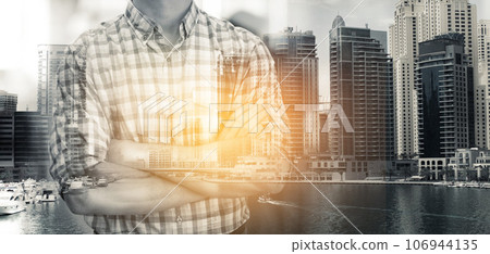 Business man, double exposure and arms crossed by city skyline with entrepreneur, career or urban overlay. Businessman, ceo and holographic cityscape with metro buildings at workplace with lens flare Business man, double exposure and arms crossed by city skyline with entrepreneur, career or urban overlay. Businessman, ceo and holographic cityscape with metro buildings at workplace with lens flare 106944135