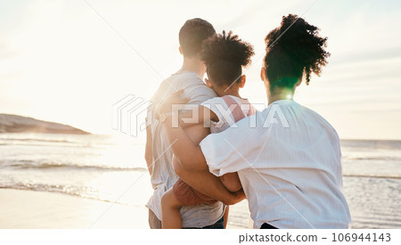 Family, beach and watching sunset, travel and bonding, love with back view and together outdoor. Vacation, ocean and people in nature, man and woman with kid, sunshine and adventure with peace Family, beach and watching sunset, travel and bonding, love with back view and together outdoor. Vacation, ocean and people in nature, man and woman with kid, sunshine and adventure with peace 106944143
