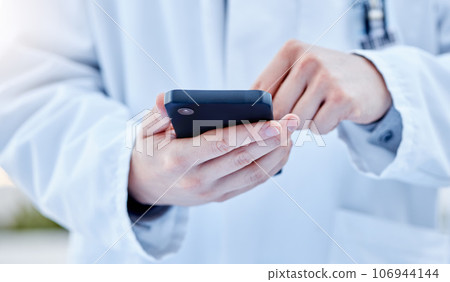 Closeup, hands and doctor with smartphone, online reading or connection for typing. Zoom, medical professional or cellphone for social media, research or search internet for information or healthcare Closeup, hands and doctor with smartphone, online reading or connection for typing. Zoom, medical professional or cellphone for social media, research or search internet for information or healthcare 106944144