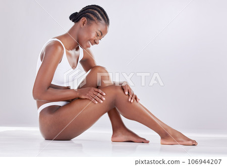 Skincare, wellness and black woman on studio floor for shaving, grooming and hair removal. Beauty, underwear and female person on white background for epilation cosmetics, natural skin or body care Skincare, wellness and black woman on studio floor for shaving, grooming and hair removal. Beauty, underwear and female person on white background for epilation cosmetics, natural skin or body care 106944207