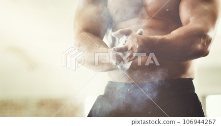 Hands, sports and powder dust in gym for grip, workout and exercise for wellness. Fitness, health and man, bodybuilder or male athlete clapping with chalk and ready to start training for muscles. 106944267