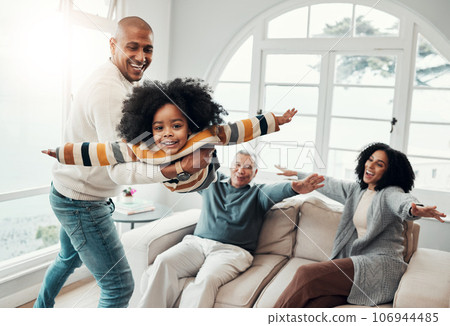 Airplane, father and girl in lounge, family an playing with love, quality time and cheerful together. Portrait, happy dad lifting daughter and granddad with mother, joyful and games in living room 106944485