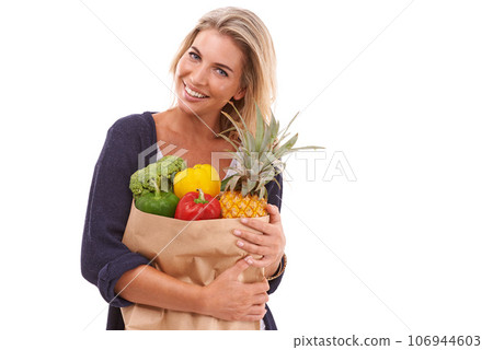 Shopping, portrait or happy woman with vegetables, fruit or healthy food in studio on white background. Diet, smile or happy customer with fruits isolated on marketing or advertising mockup space 106944603