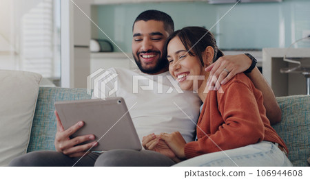 Tablet, couple and laughing on couch in home for social media, funny news and online meme. Happy man, woman and relax with digital technology, subscription and streaming comedy on network connection 106944608