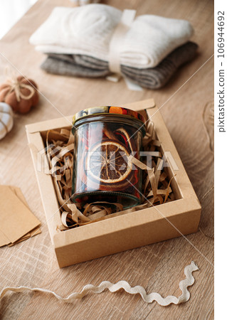 DIY Christmas gift ideas. Craft Cocktail Kits for Gifting in jars. Homemade Dry Holiday Potpourri with oranges, cinnamon sticks and spices 106944692