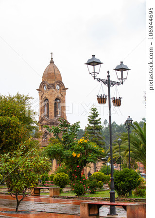 Beautiful central square and the San Jeronimo Parish Temple of the small town of Nobsa well known for the traditional handmade ruanas in the region of Boyaca in Colombia 106944695