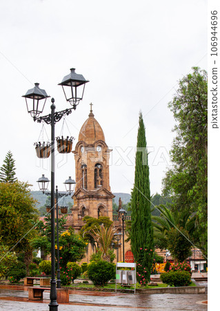 Beautiful central square and the San Jeronimo Parish Temple of the small town of Nobsa well known for the traditional handmade ruanas in the region of Boyaca in Colombia 106944696