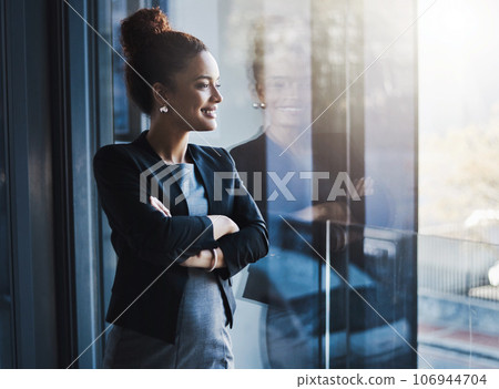 Business woman, window and smile for vision, goals and future of career with ideas, mission or mindset. Young businesswoman, focus and thinking in workplace with memory, reflection or corporate dream Business woman, window and smile for vision, goals and future of career with ideas, mission or mindset. Young businesswoman, focus and thinking in workplace with memory, reflection or corporate dream 106944704