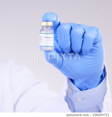 Vaccine, doctor hands and monkeypox bottle for safety, medicine and healthcare innovation in studio. Closeup vaccination, person and liquid vial for drugs, medical virus and pharmaceutical research Vaccine, doctor hands and monkeypox bottle for safety, medicine and healthcare innovation in studio. Closeup vaccination, person and liquid vial for drugs, medical virus and pharmaceutical research 106944731