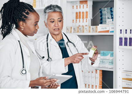 Pharmacy, inventory and women on digital tablet for prescription, label and information check. Pharmacist, colleagues and ladies online, internet and search while doing stock at a clinic dispensary Pharmacy, inventory and women on digital tablet for prescription, label and information check. Pharmacist, colleagues and ladies online, internet and search while doing stock at a clinic dispensary 106944791