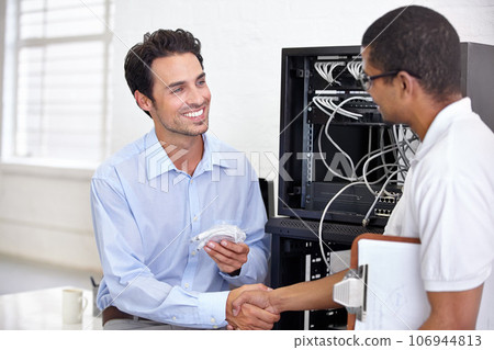 Server room, it support and handshake with an engineer talking to a business man about cyber security. Network, database and contract agreement with a technician chatting about information technology 106944813