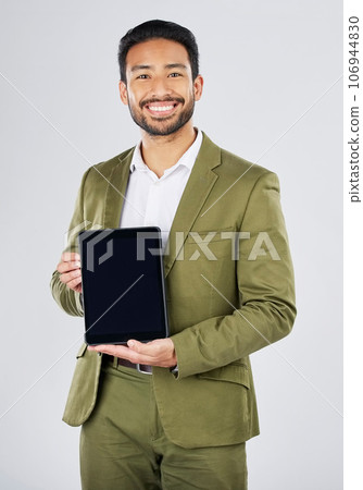 Happy asian man, portrait and tablet mockup in advertising against a white studio background. Businessman with technology display or screen in marketing, advertisement or branding on mock up space Happy asian man, portrait and tablet mockup in advertising against a white studio background. Businessman with technology display or screen in marketing, advertisement or branding on mock up space 106944830