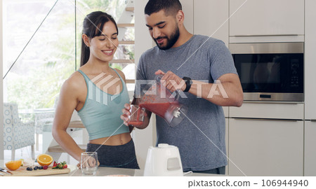 Health smoothie, couple and fitness nutritionist with fruit, healthy food and smile at home. Nutrition, breakfast and diet of a woman and man together with juice blender and happiness from cooking Health smoothie, couple and fitness nutritionist with fruit, healthy food and smile at home. Nutrition, breakfast and diet of a woman and man together with juice blender and happiness from cooking 106944940