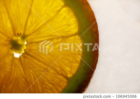 Macro of a fresh slice of orange. Macro of a fresh slice of orange. 106945006