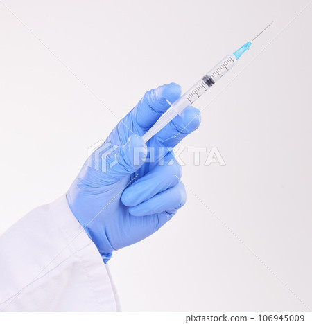 Healthcare, hand and doctor with vaccine, injection or shot in studio against a white background. Medicine, vaccination and man health expert with needle for medical, innovation or disease treatment Healthcare, hand and doctor with vaccine, injection or shot in studio against a white background. Medicine, vaccination and man health expert with needle for medical, innovation or disease treatment 106945009