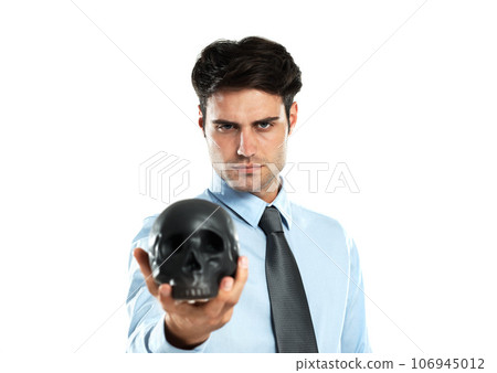 Portrait, black skull and business man in studio for death, symbol and failure against a white background. Face, fail and man showing human head for manipulation, emoji and bad luck while isolated Portrait, black skull and business man in studio for death, symbol and failure against a white background. Face, fail and man showing human head for manipulation, emoji and bad luck while isolated 106945012