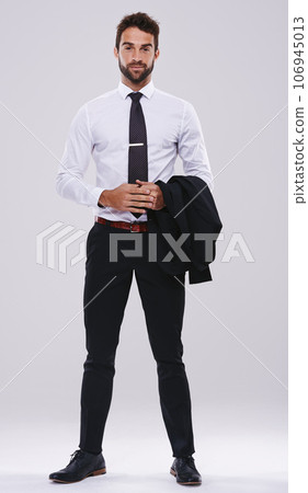 The business world is my playground. Studio shot of a handsome and well-dressed young man. 106945013