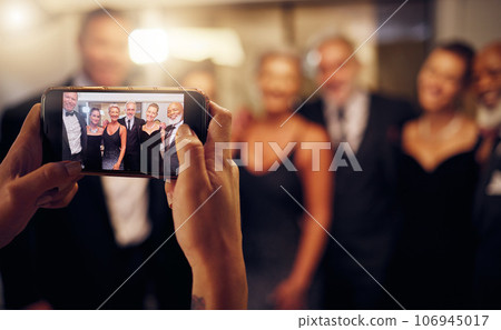 Phone photography, hands or people in a party to celebrate goals or new year at luxury event. Women, screen or group of friends smile in pictures for social media at fun dinner gala or happy birthday 106945017