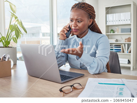 Angry, phone and stressed black woman on a business call about tax, audit and compliance email on laptop at office desk. Employee working mad, internet and tech glitch on the website of the company Angry, phone and stressed black woman on a business call about tax, audit and compliance email on laptop at office desk. Employee working mad, internet and tech glitch on the website of the company 106945047