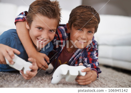 Boys playing video game, friends in portrait and gaming with technology, esports and entertainment in living room. Gamer kids play games on console at home, youth and male children have fun together 106945142