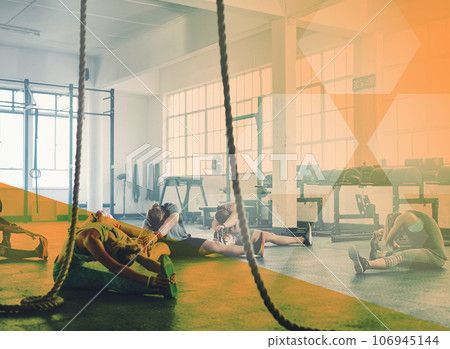 Fitness, stretching and a group of people at gym for exercise, workout and training goals. Athlete men and women team together for challenge, motivation or strong muscle warm up at club with overlay 106945144