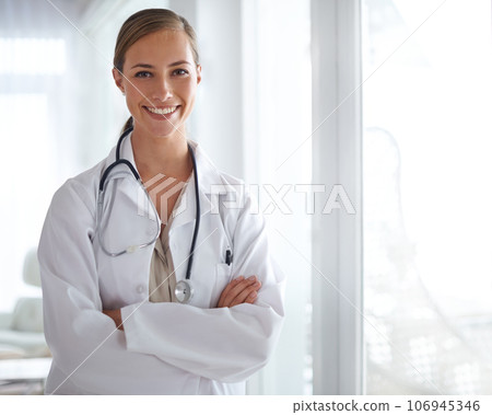 Put your trust in her. Portrait of an attractive young doctor standing with her arms folded. 106945346