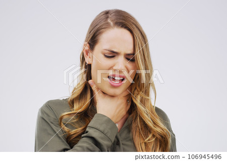Woman, sore throat and virus from cough, allergies or bacteria against a white studio background. Sick female person touching neck in pain, allergy or flu of cold, illness or tuberculosis infection Woman, sore throat and virus from cough, allergies or bacteria against a white studio background. Sick female person touching neck in pain, allergy or flu of cold, illness or tuberculosis infection 106945496