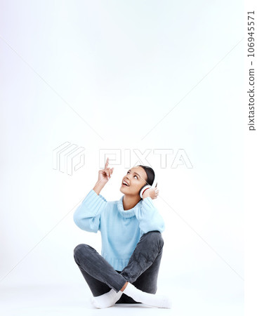 Studio music, relax and woman point at radio sales promotion, advertising space or audio podcast mockup. Marketing commercial, headphones deal and sound streaming female listening on white background Studio music, relax and woman point at radio sales promotion, advertising space or audio podcast mockup. Marketing commercial, headphones deal and sound streaming female listening on white background 106945571