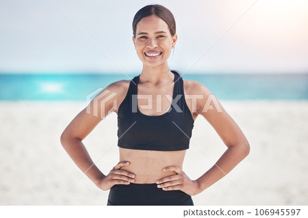 Fitness, portrait and happy woman at a beach for running, workout and sports exercise in nature. Ocean, smile and face of female runner at sea for wellness, health and training routine in Jamaica 106945597