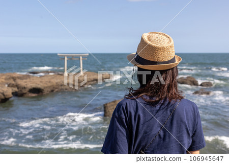 Oarai Coast, woman looking at the torii gate of Kamiiso Oarai Coast, woman looking at the torii gate of Kamiiso 106945647
