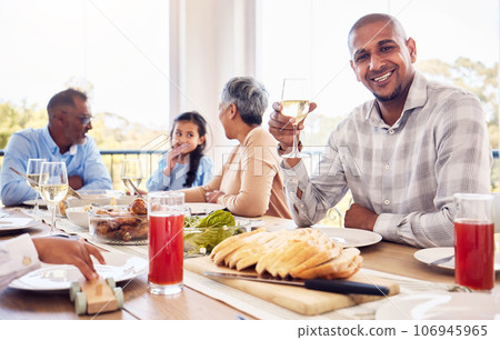 Wine, portrait and man at happy family brunch, lunch or celebration event for reunion, bond and enjoy quality time together. Love smile, happiness and group of people eating food meal at Mexico home 106945965